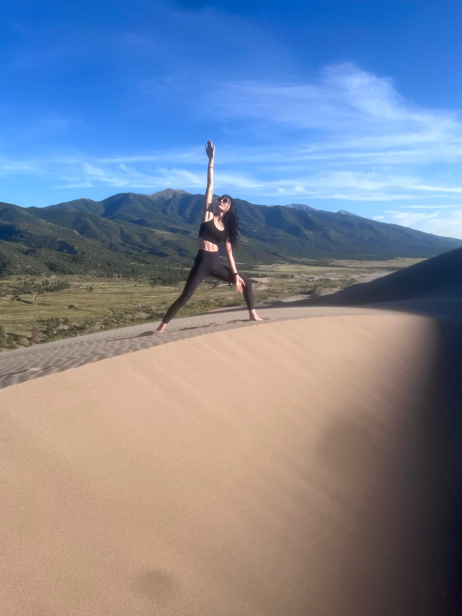 Alexandria practicing yoga on the Colorado dunes